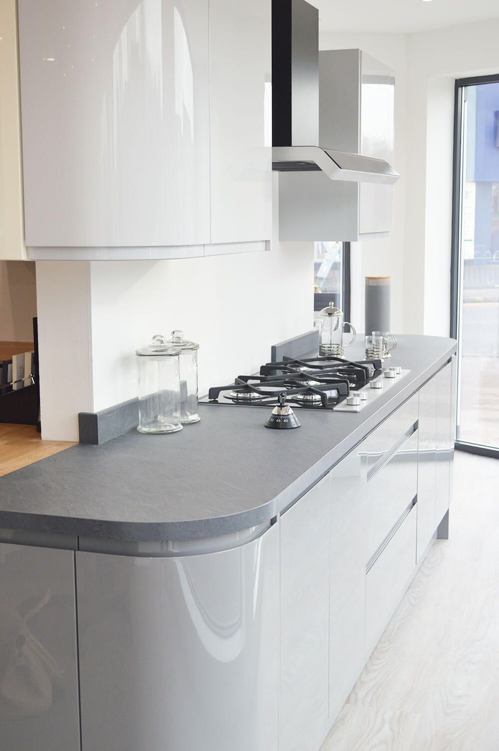A kitchen with a stove top oven and a counter top.