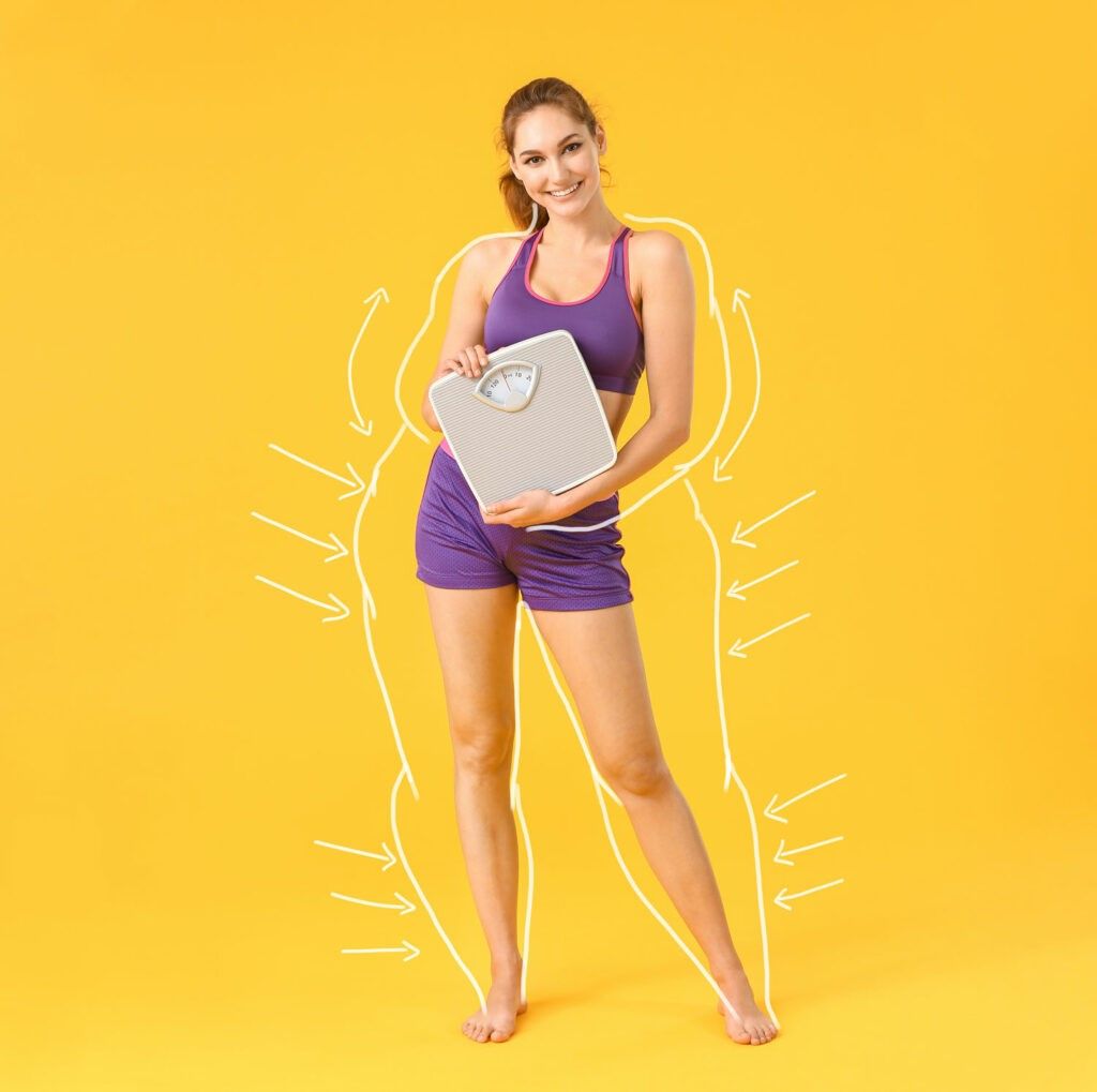 A woman who lost weight is holding a scale on a yellow background.