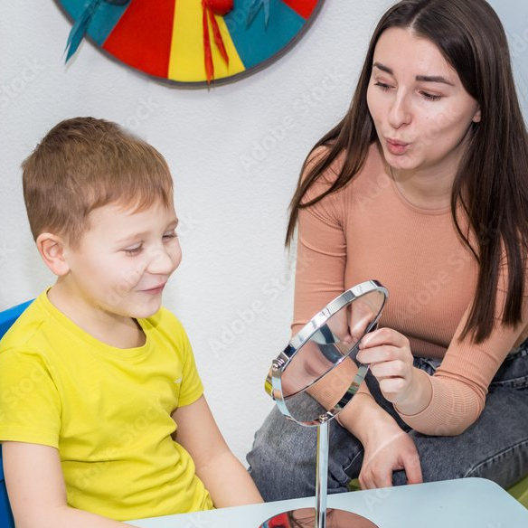 instructor and boy with mirror