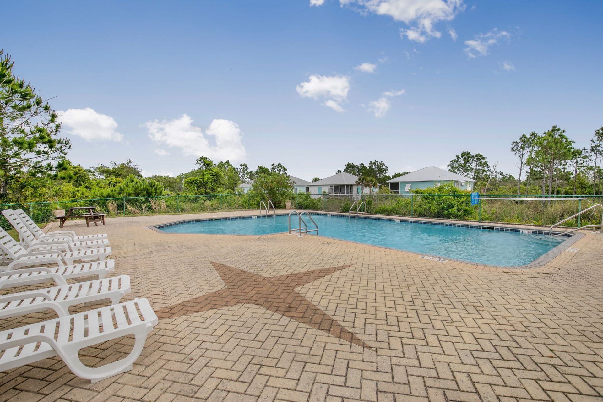 A large swimming pool with a star on the ground