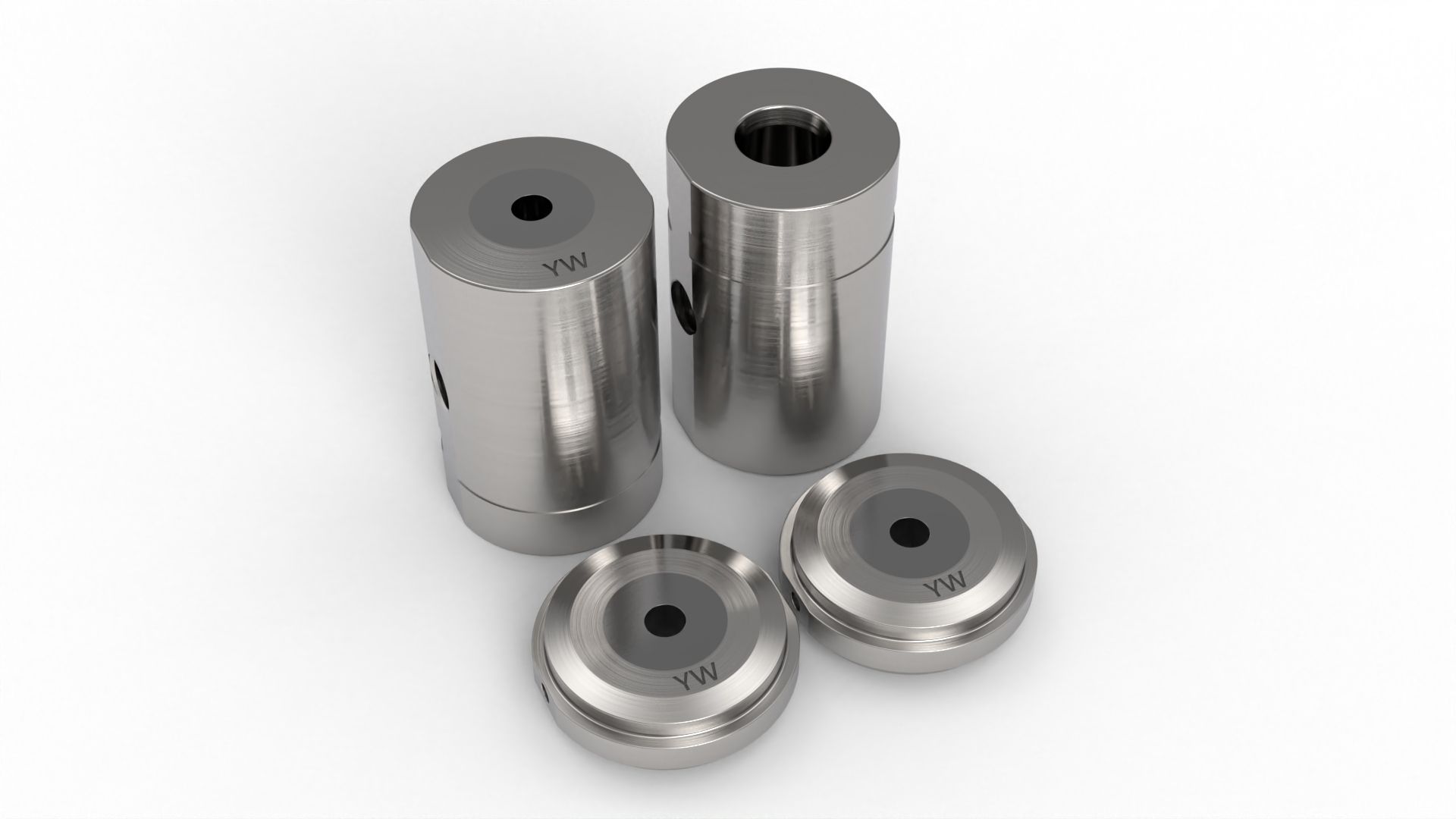 Four metal mechanical parts on a white surface, two tall cylinders, two shorter disks, all with central holes.