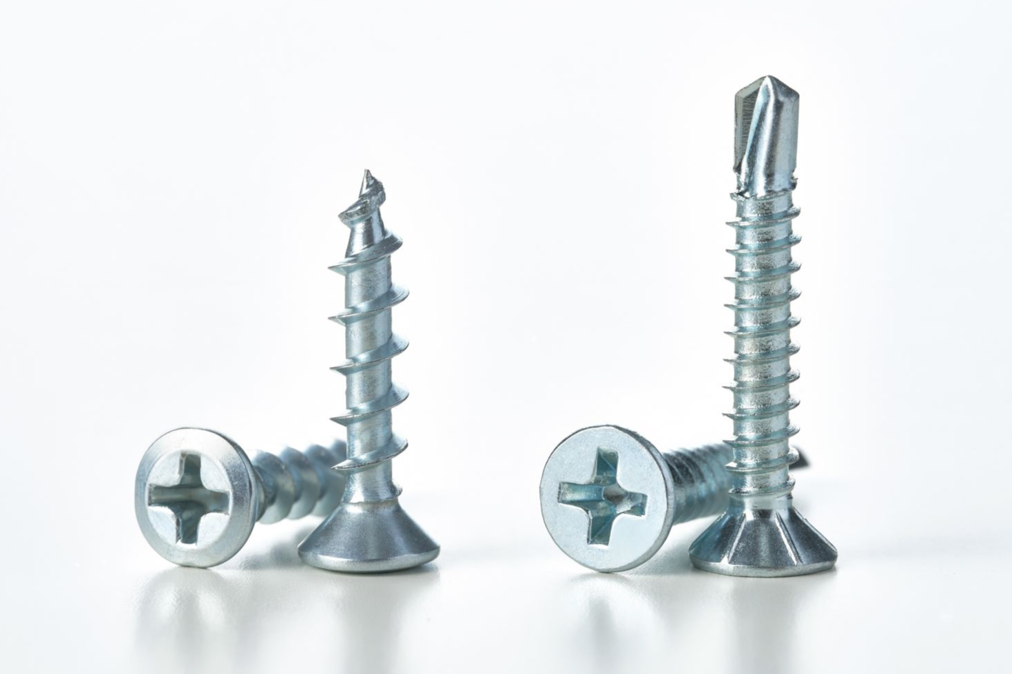 Two silver drywall screws with Phillips head and pointed tips.