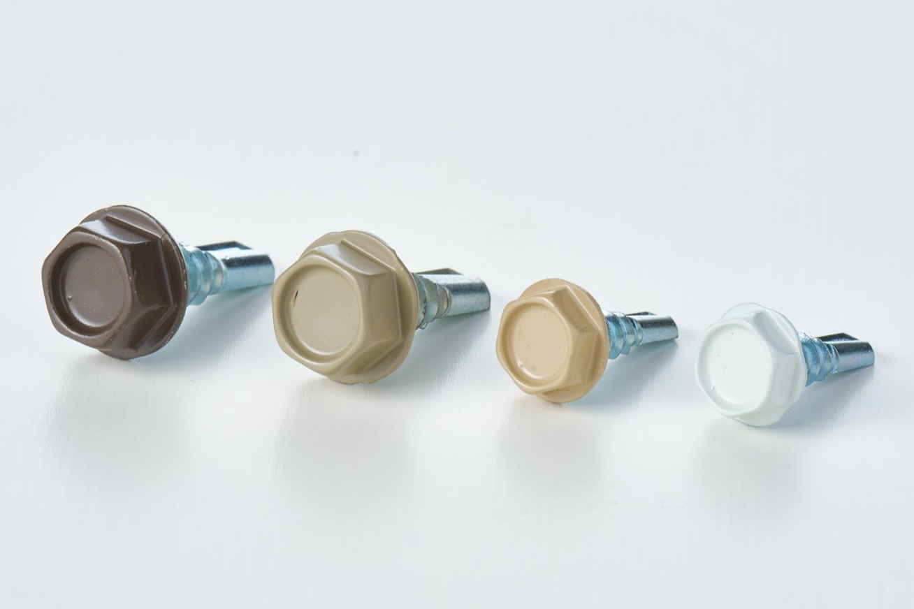 Four colored hexagonal head screws in brown, tan, beige, and white.