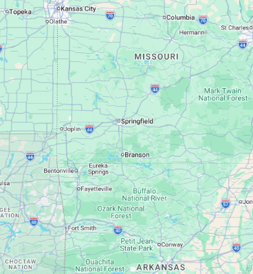 Map of Missouri with city labels and surrounding states in light green and blue roads/icons
