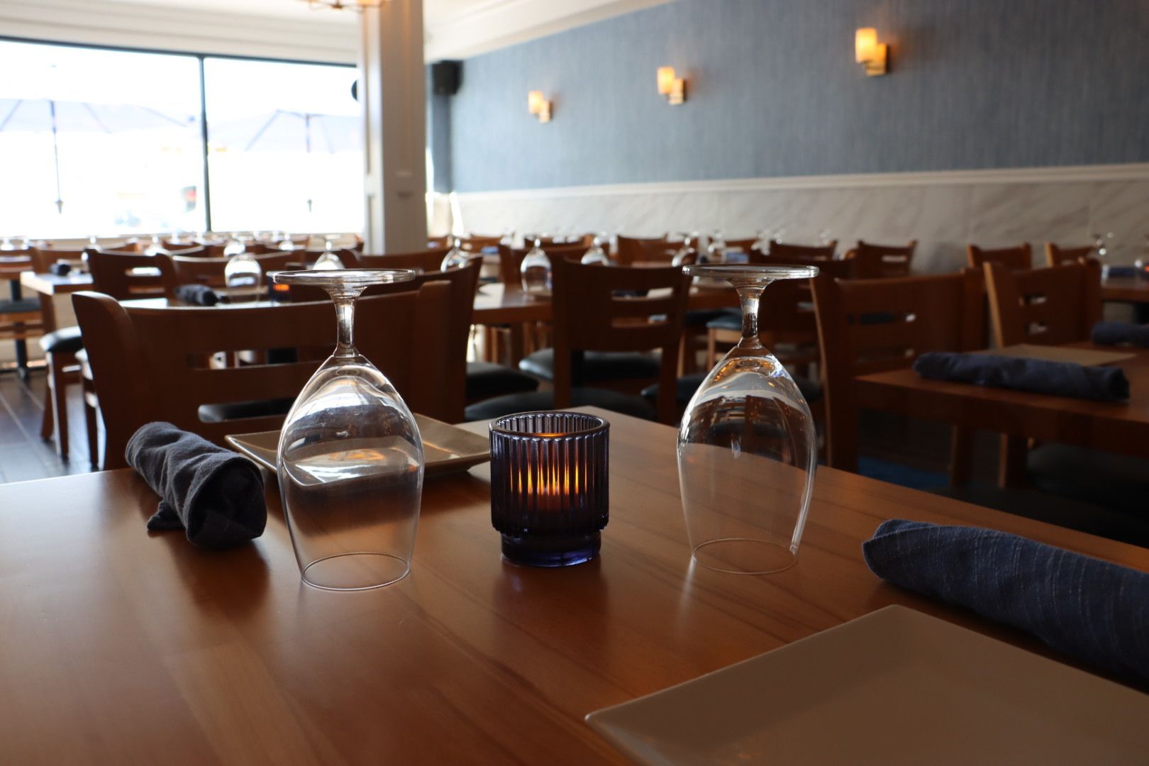 Drift Seafood restaurant with a candle and wine glasses on the table