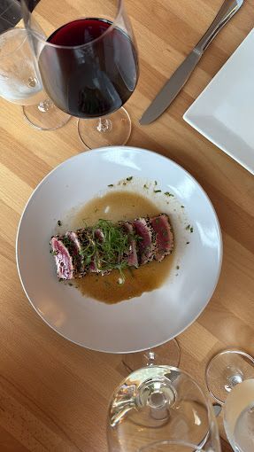 A plate of seared sesame tuna in soy sauce