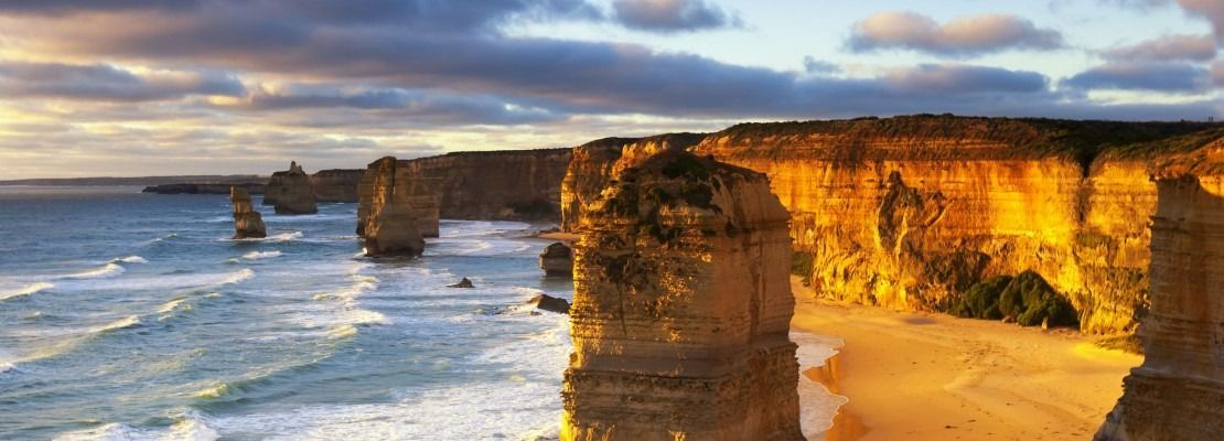 Coastal Rock Formations at Sunset Along a Beach — Immigration Agents in Cairns North, QLD
