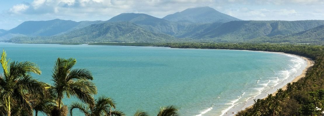 Beach With Turquoise Water, White Sand, Palm Trees — Immigration Agents in Cairns North, QLD