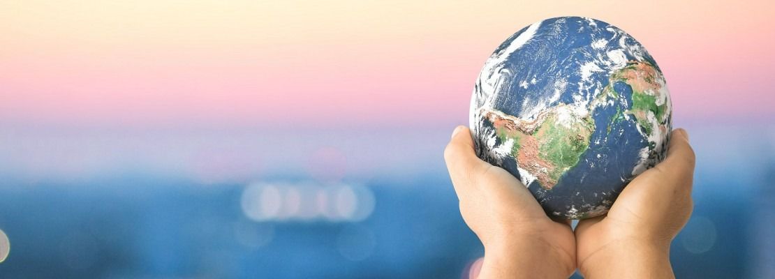 Hands Cupping a Globe — Immigration Agents in Cairns North, QLD