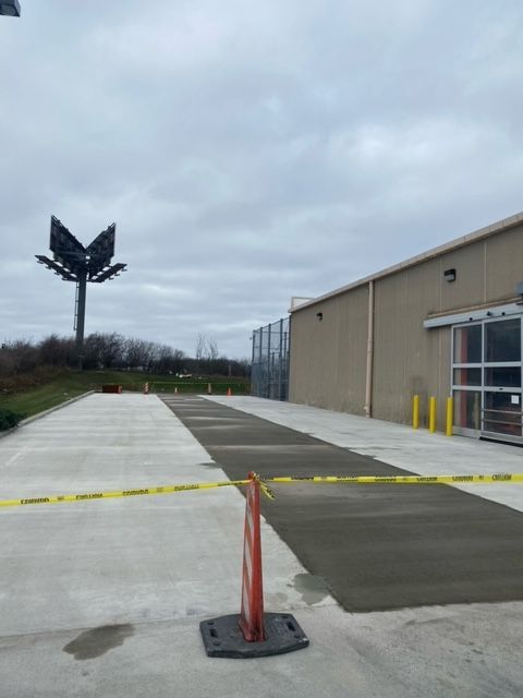 A Large Building With A Large Billboard — Rome, NY — EWS Sealcoating