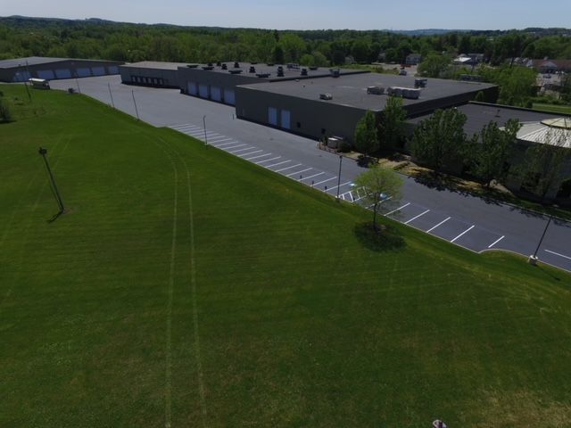 An Aerial View Of A Large Building — Rome, NY — EWS Sealcoating