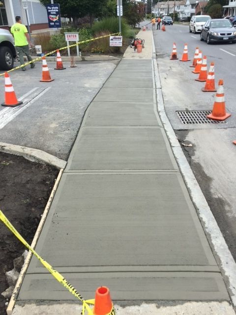 A Row Of Orange And White Traffic Cones — Rome, NY — EWS Sealcoating