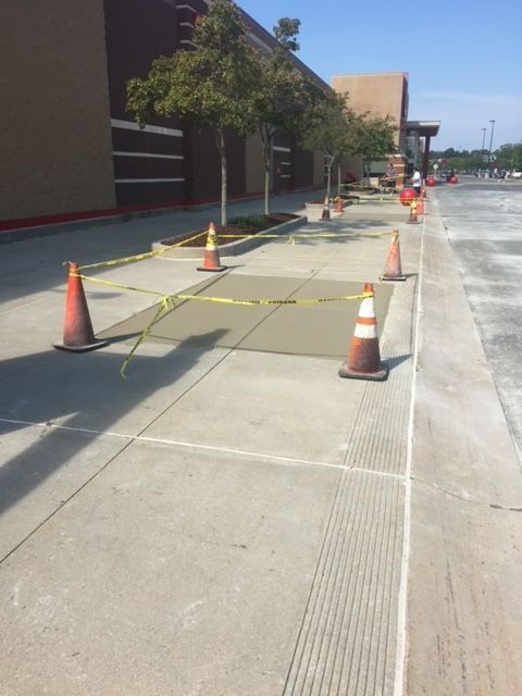 Open Area With Orange And White Traffic Cones On It — Rome, NY — EWS Sealcoating