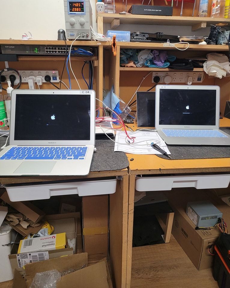 Two MacBooks Displaying Common Computer Problems Screens