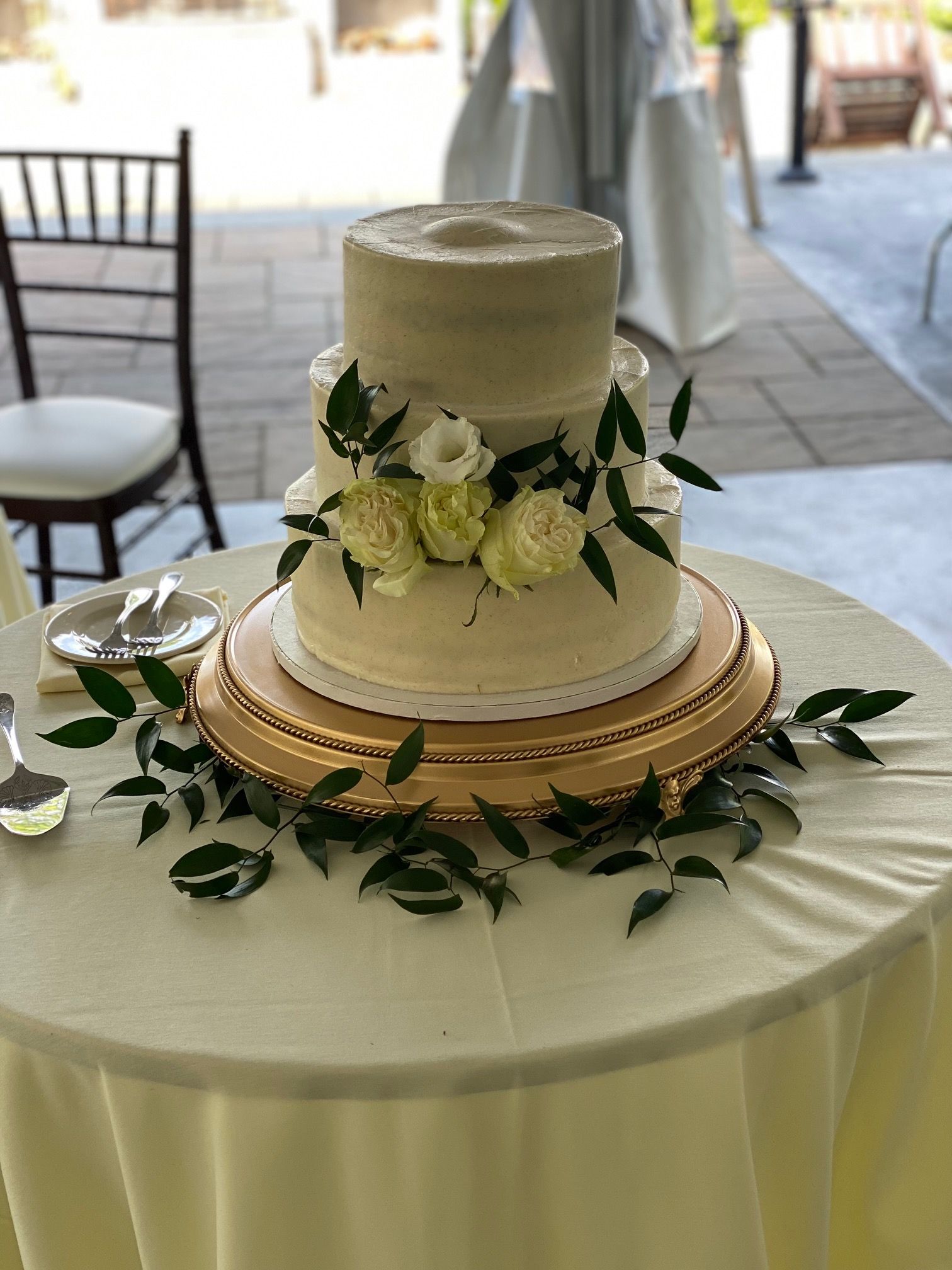 A wedding cake is sitting on top of a table.
