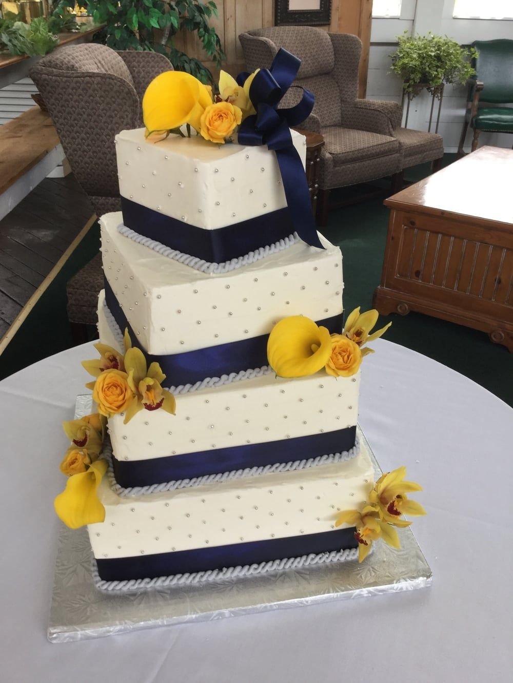 Skewed Square Floral Wedding Cake with Blue Ribbon