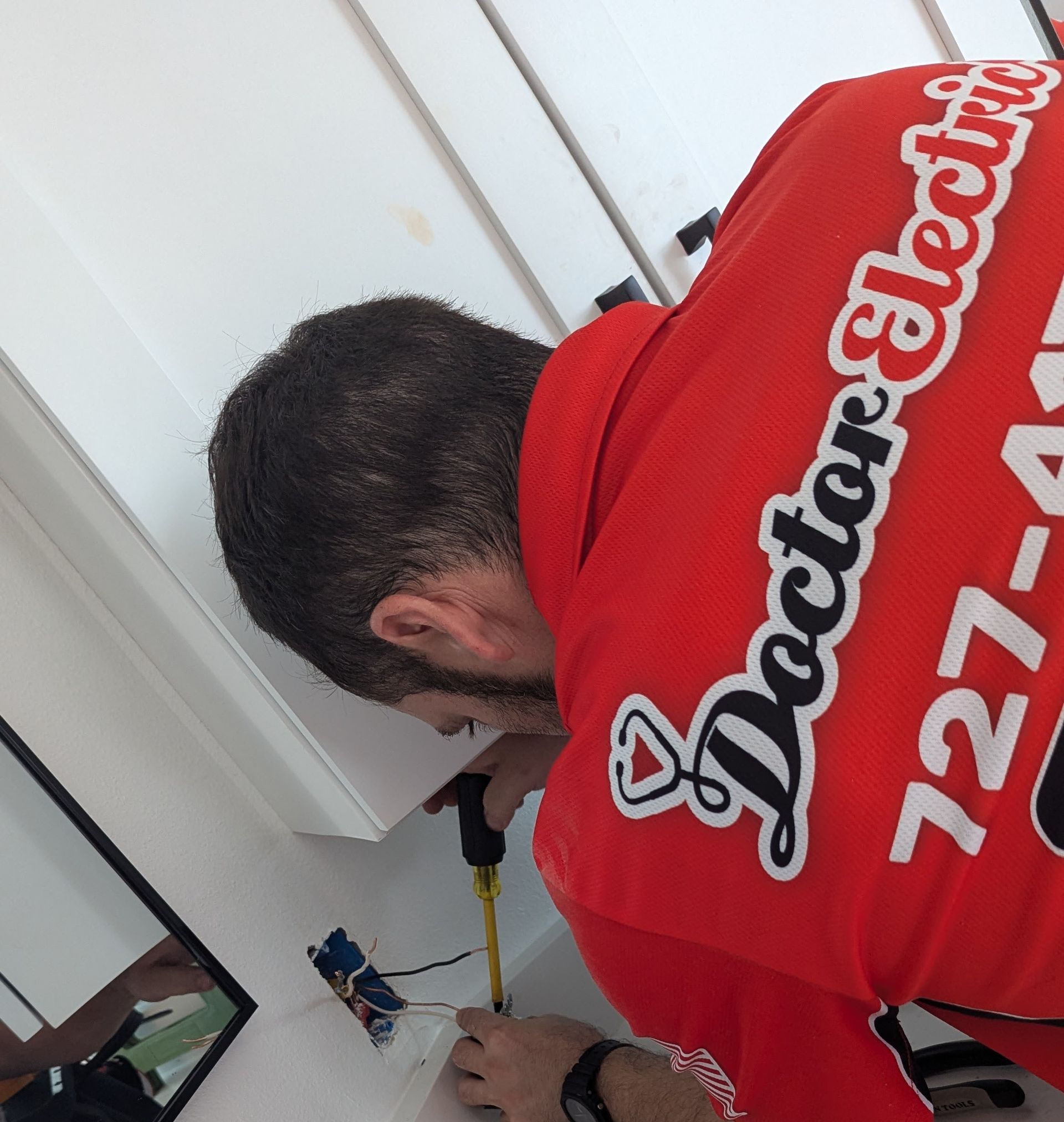 screwdriver into a switch panel