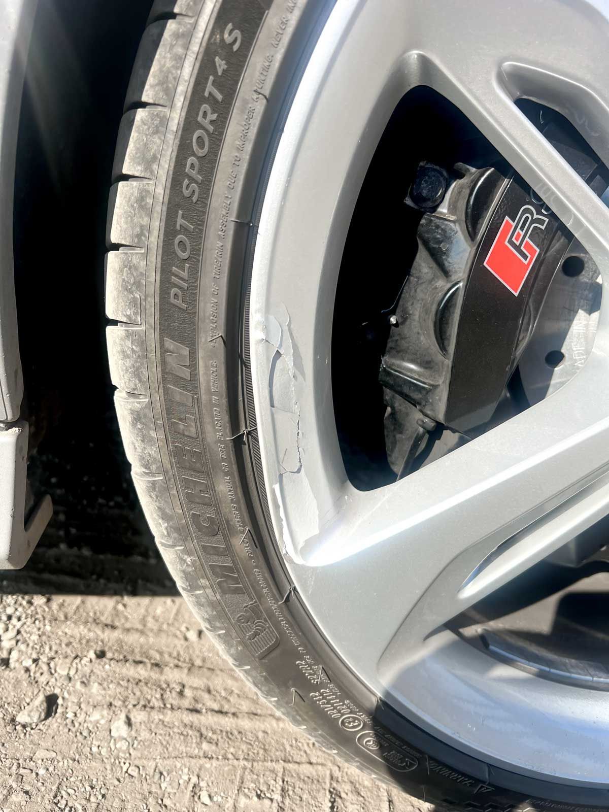 Audi RS7 bent wheel causing paint to peel