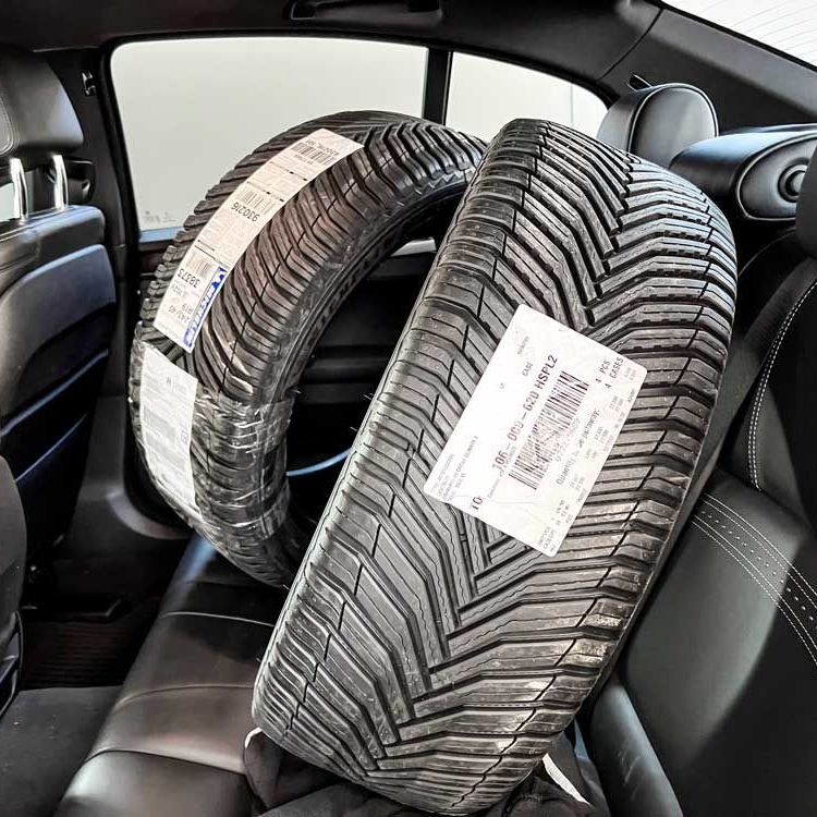 my Michelin CrossClimate2 all-season tires on the back seat of my car