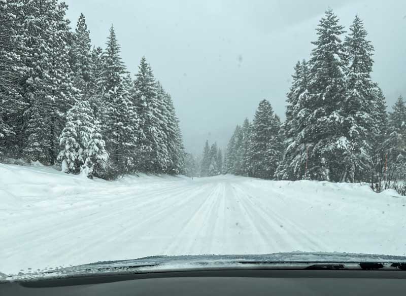 winter tire testing taking place on a snowy road