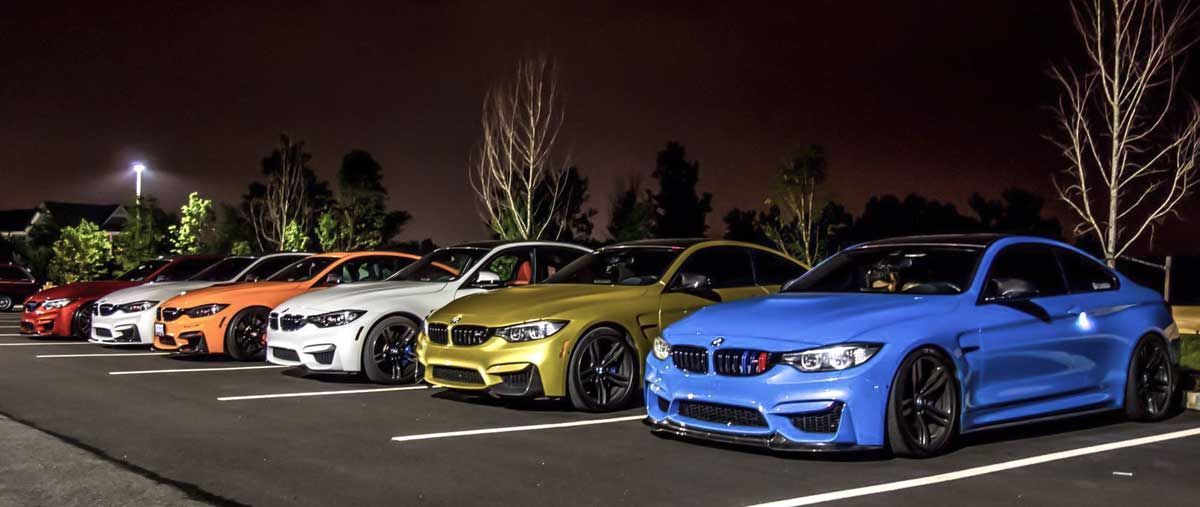 bmw m3 and bmw m4 vehicles lined up