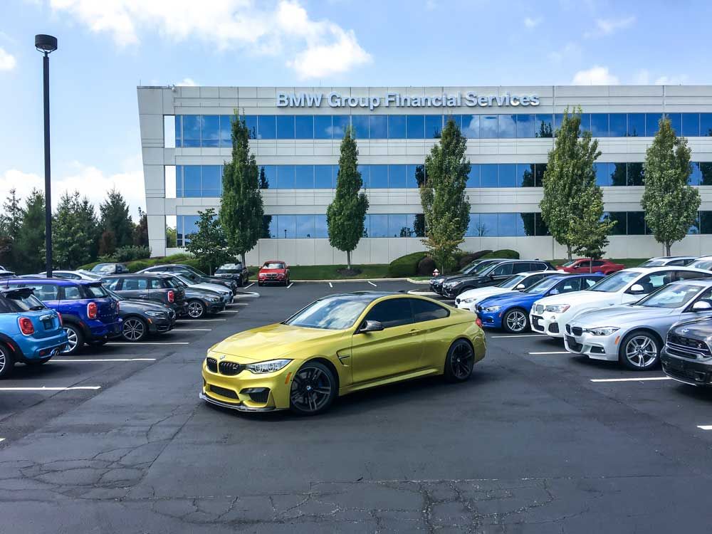 leased bmw in front of bmw group financial services building
