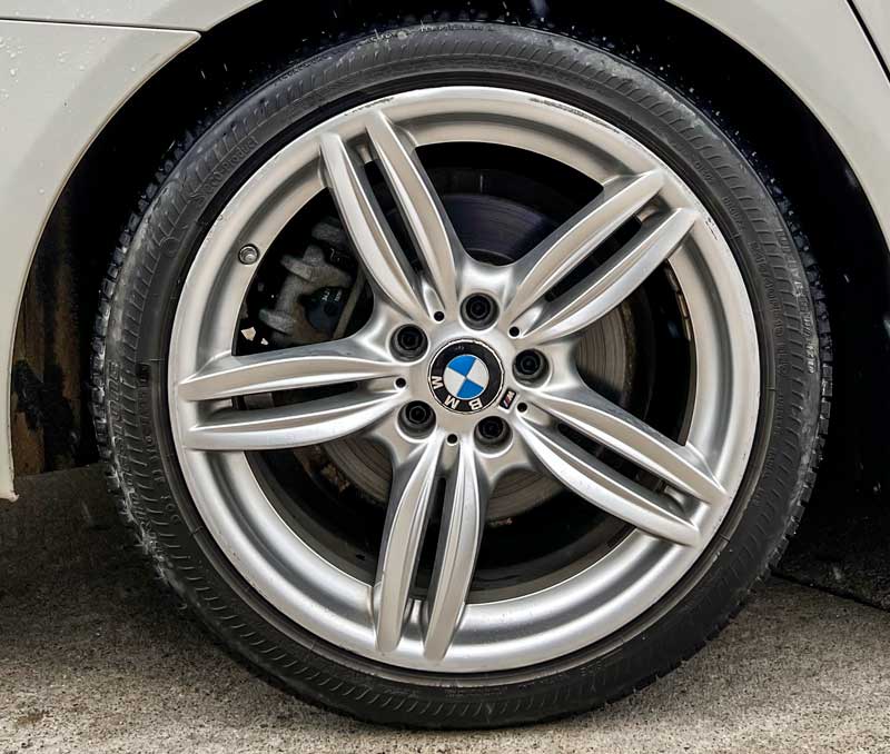 BMW wheel with curb rash