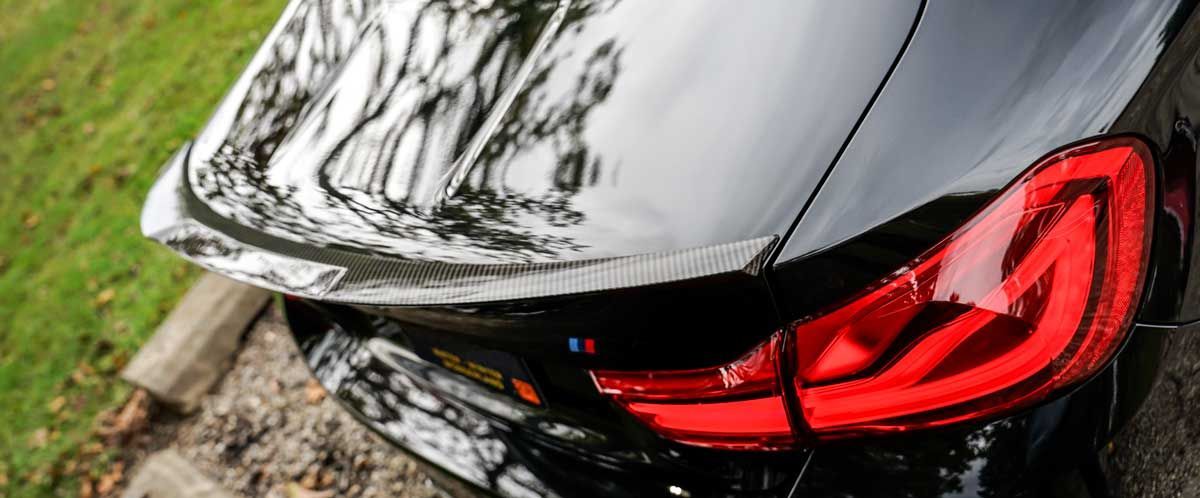 bmw m4 with rw carbon rear trunk spoiler installed