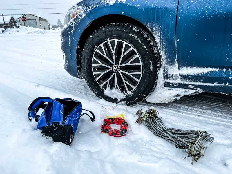 The Car Data testing snow chains in the blizzard of Washington Mountains