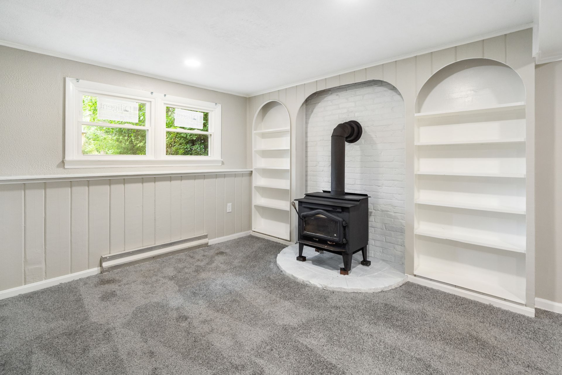 There is a wood stove in the middle of the room.