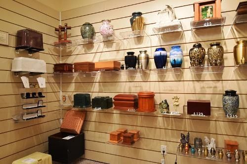 A room filled with urns and boxes on shelves