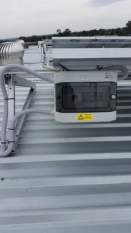 Electrical installation behind solar panel