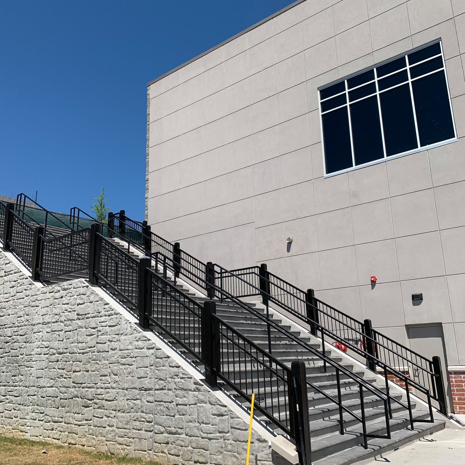 Stairs leading up to a building with a large window