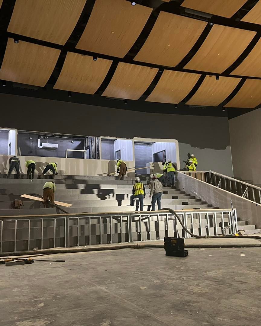 A group of construction workers are working on a building