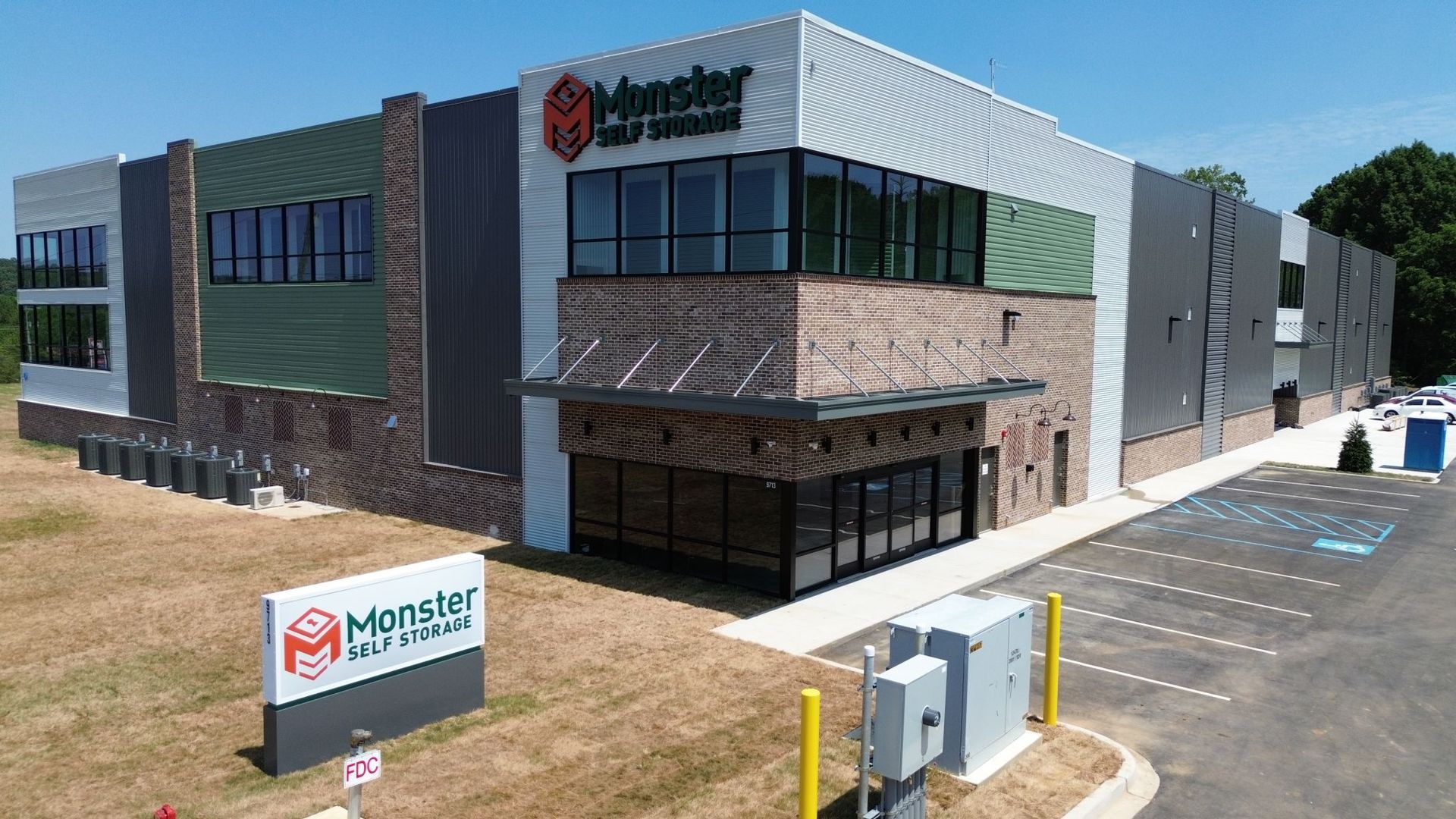 An aerial view of a large building with a sign in front of it.
