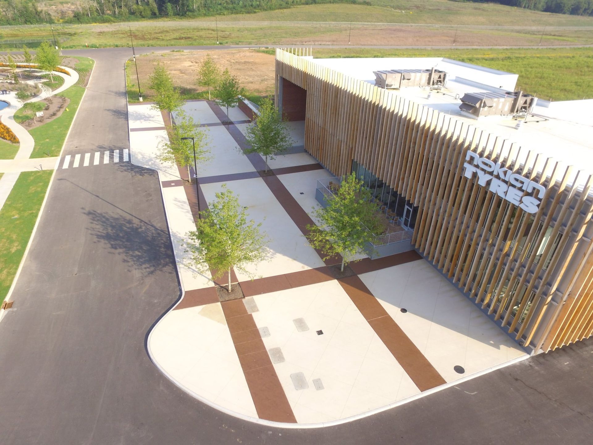 An aerial view of a building with a wooden facade