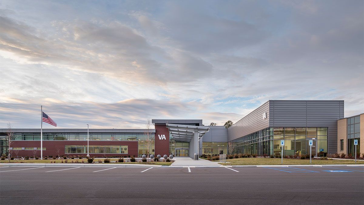 A large building with a flag in front of it.