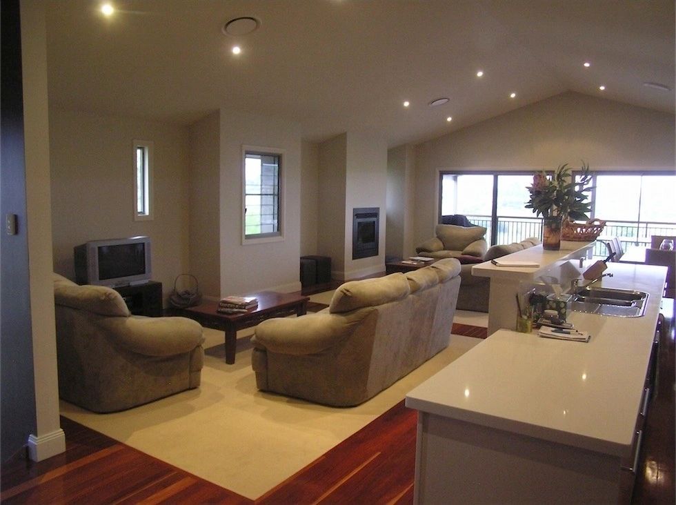 A living room filled with furniture and a television
