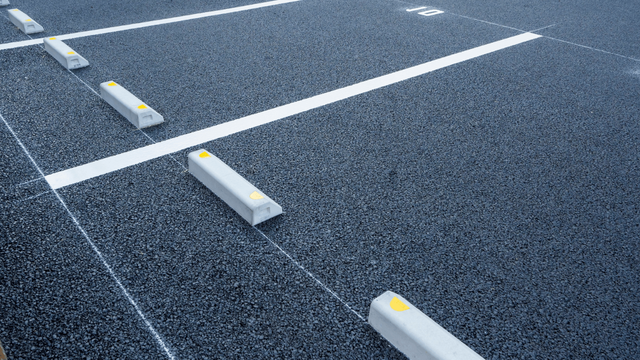 a new asphalt parking lot with line stripes compelte