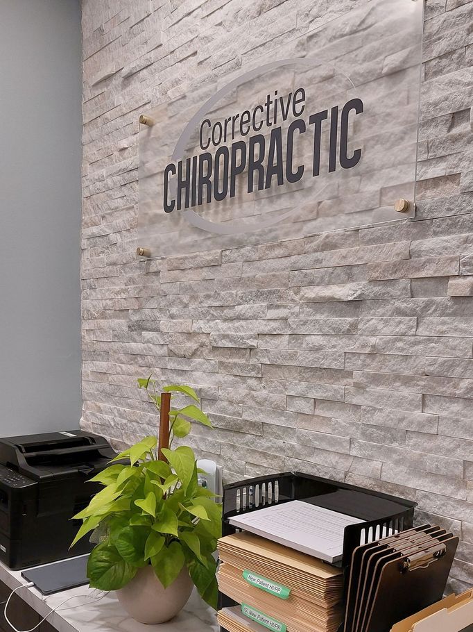 There is a sign on the wall that says corrective chiropractic.