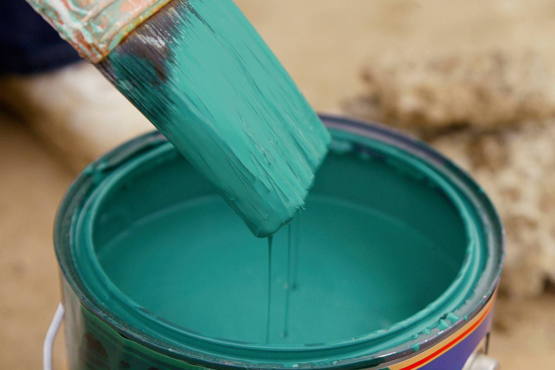 Paint Brush with Green Paint Dripping Into an Open Paint Can near Holland, Ohio (OH)