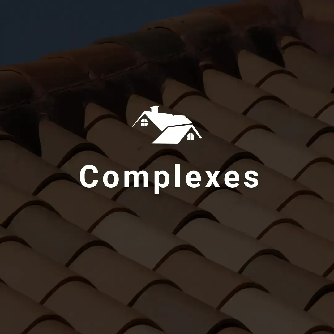 "Complexes" button overlaid on a terracotta tile roof with a house icon.