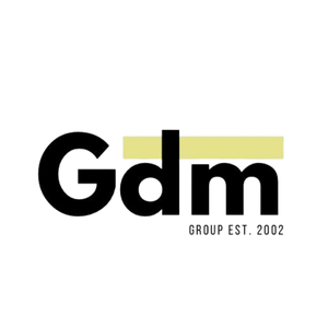 Gdm logo in black with a yellow line and small text “GROUP EST. 2002”