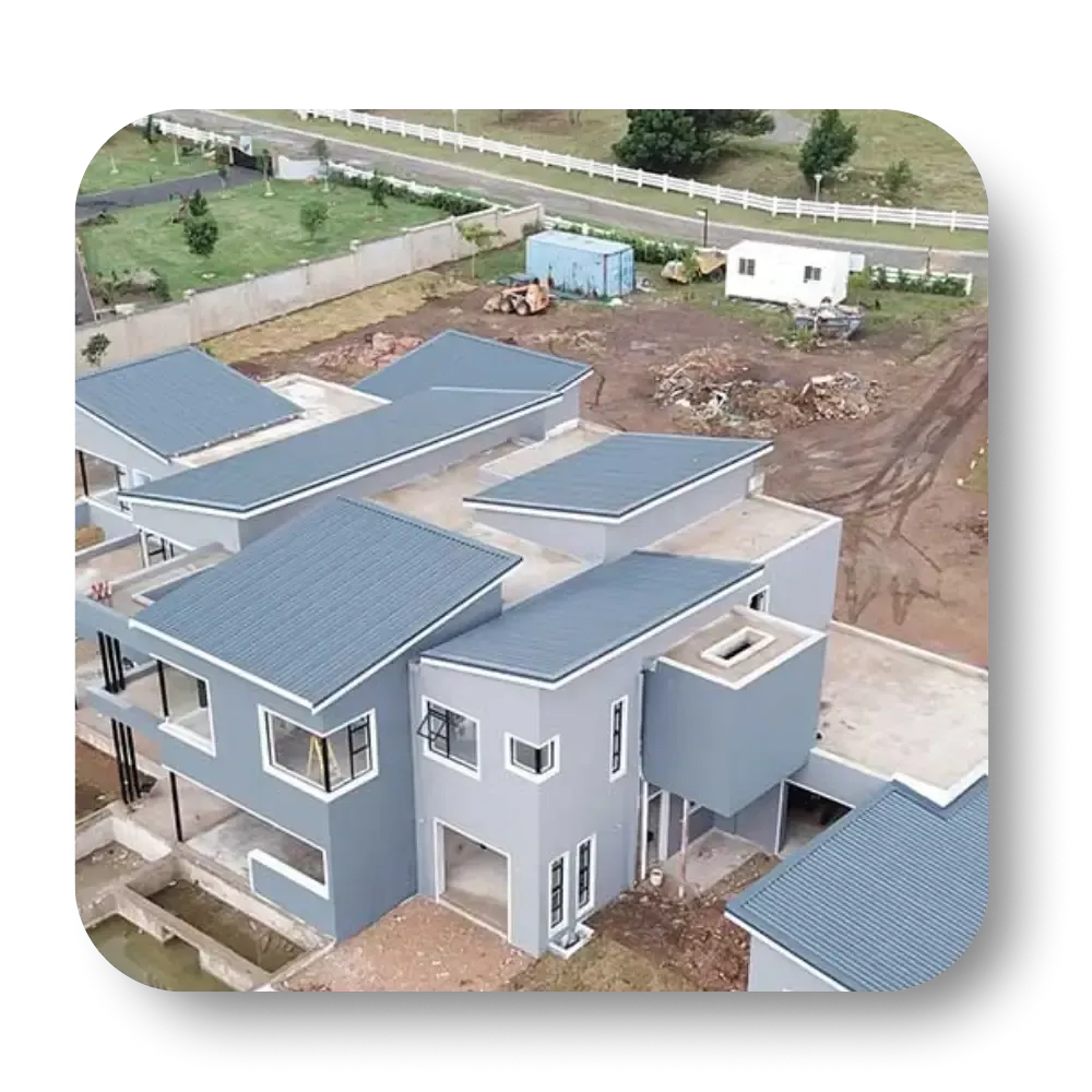 Aerial view of modern gray houses under construction.