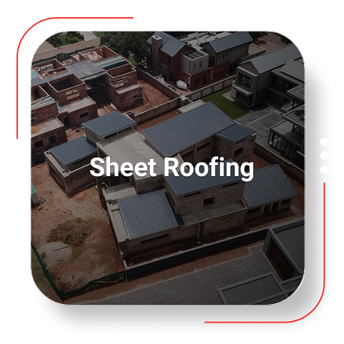 Aerial view of a residential neighborhood with sheet roofing on several buildings.