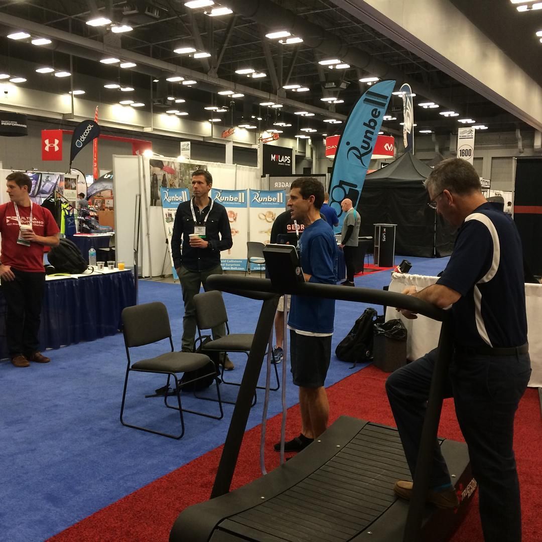 A man on a treadmill with a banner that says kenfoll on it