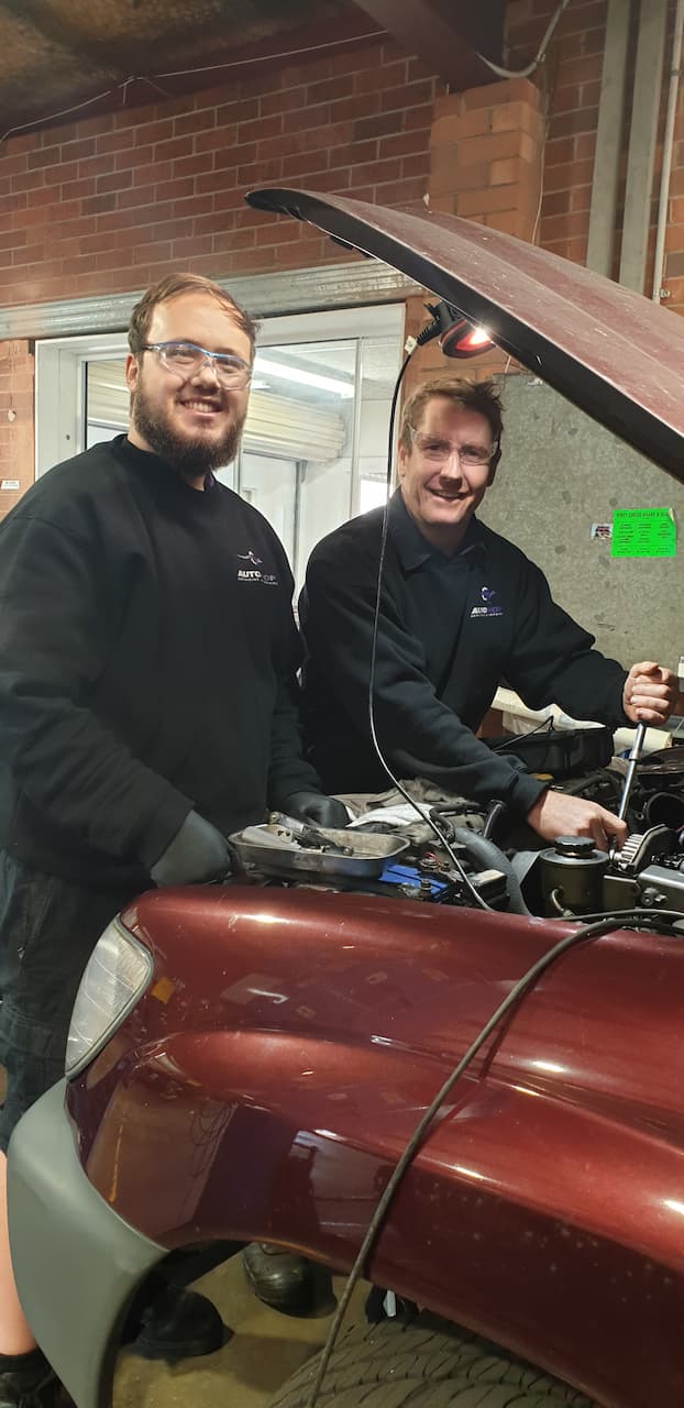 Two Mechanics Fixing Car — Servicing And Repairs in Lambton, NSW