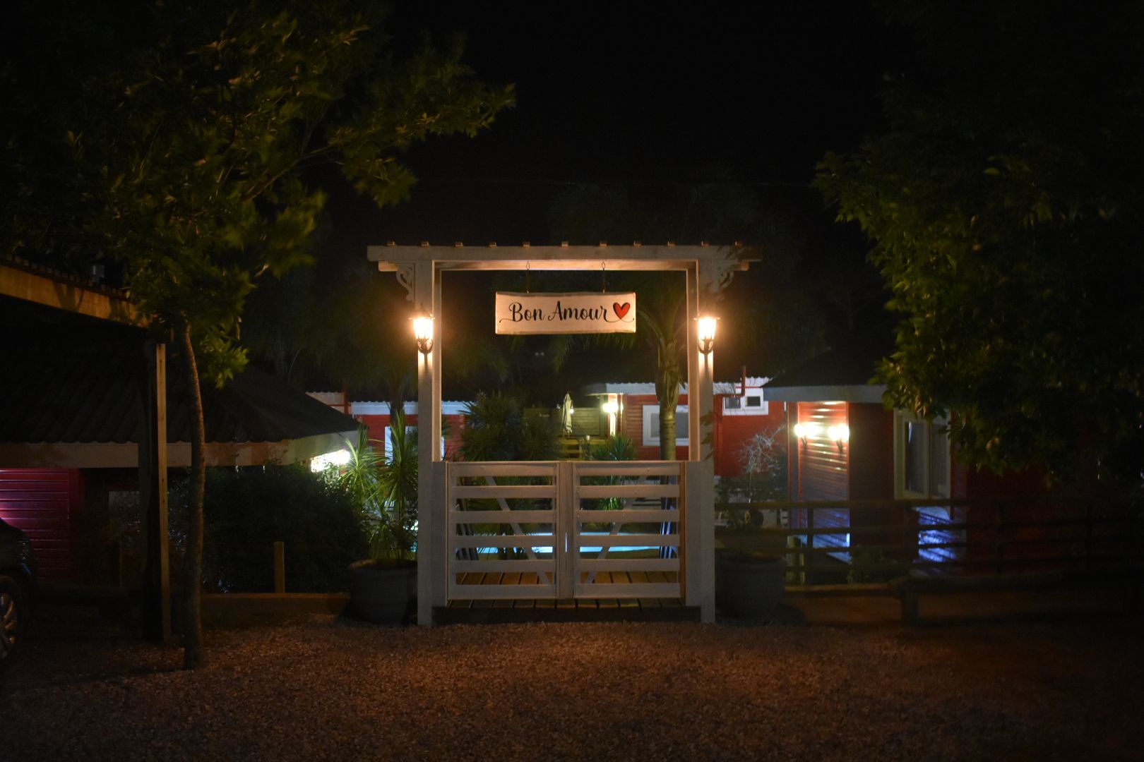 The entrance to a house is lit up at night.