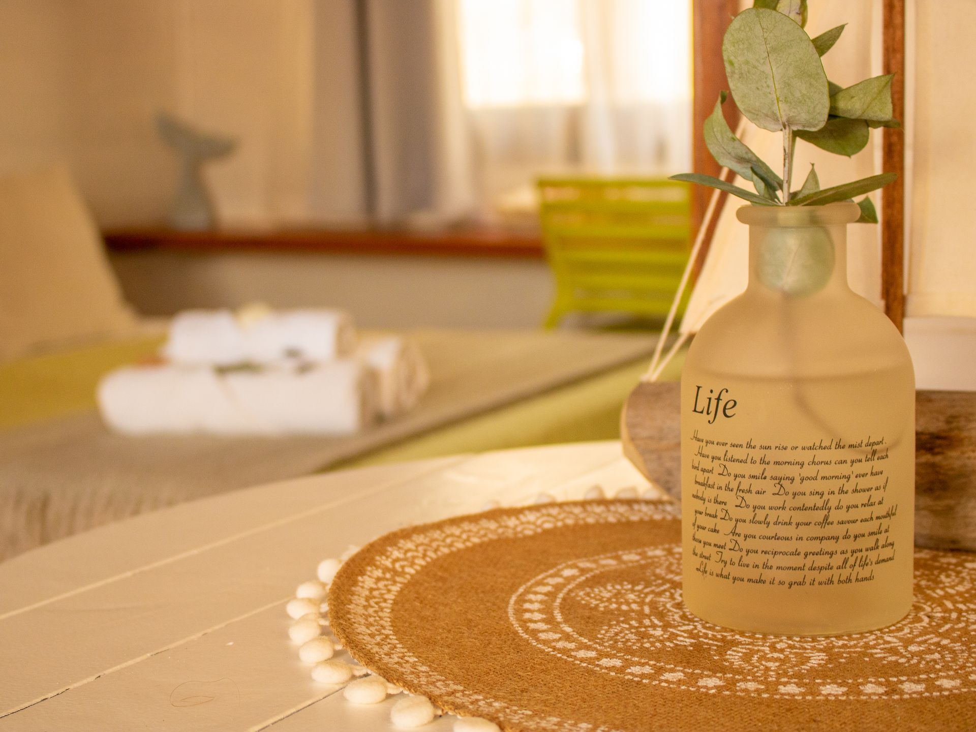 A bottle with the word life on it is sitting on a table.
