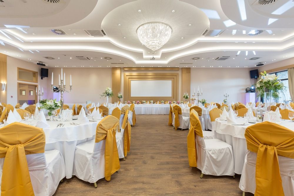 A Large Room With Tables and Chairs Set Up for a Wedding Reception — Tuncurry Washerteria In Old Bar, NSW